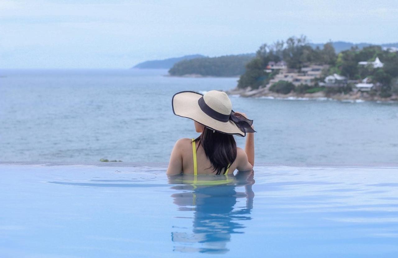 The Shore At Katathani - Adult Only - Sha Extra Plus Esterno foto A woman wearing a sun hat