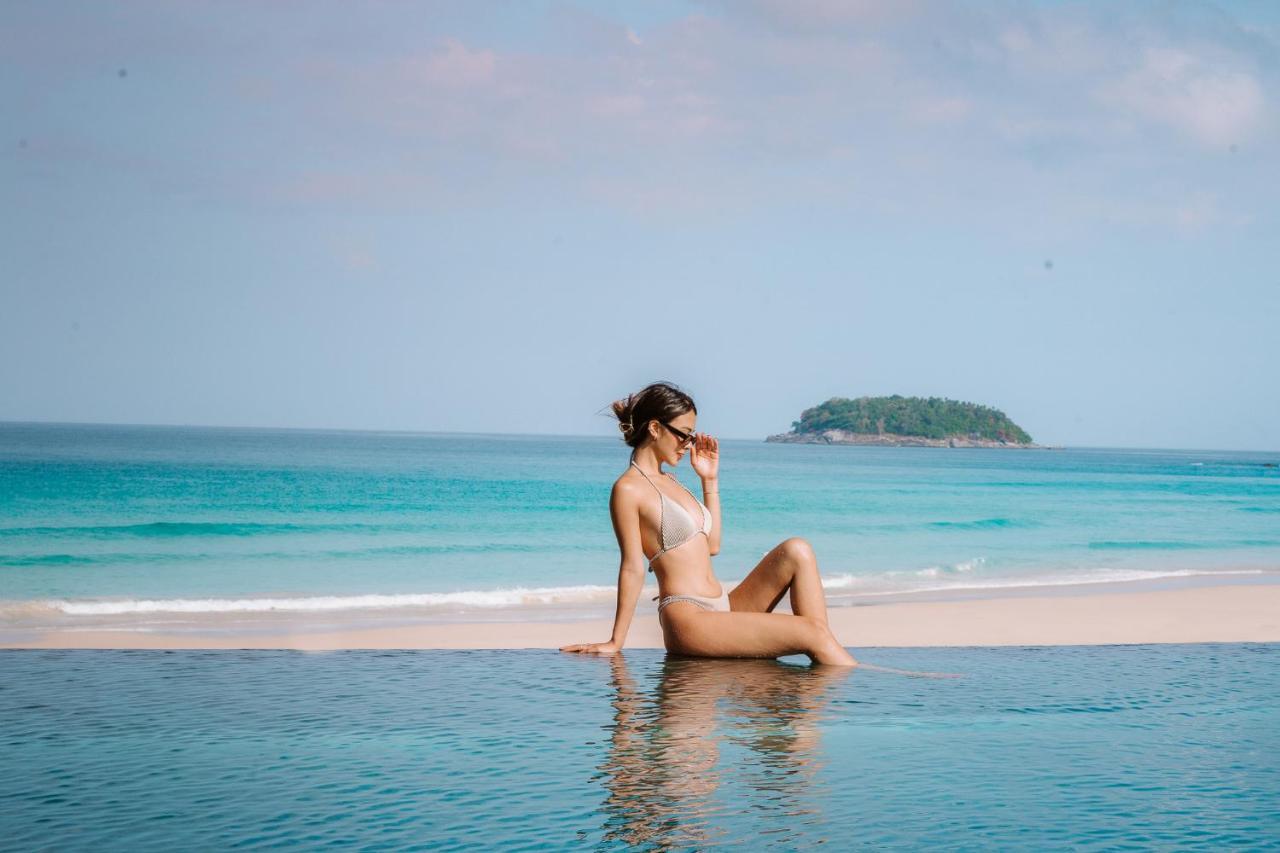 The Shore At Katathani - Adult Only - Sha Extra Plus Esterno foto A woman sunbathing on a beach